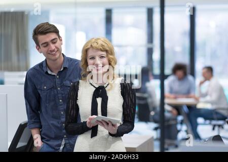 Business People Working With Tablet in startup office Stock Photo