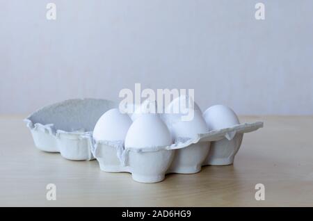 White organic eggs in cartonbox on a table Stock Photo