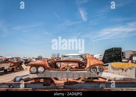 rusty old cars and trucks in a junk yard in the desert in Phoenix Arizona USA Stock Photo