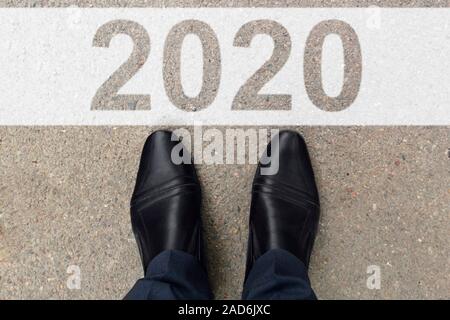 2020 Year Concept. Top view of businessman on start line, ready for new business challenge. Concept for success in the future goal and passing time. Stock Photo
