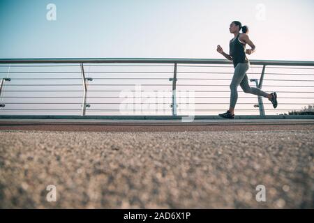 Young slim runner training outdoors stock photo Stock Photo