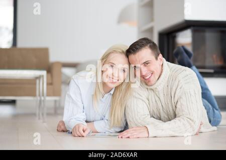 Young Couple using digital tablet on cold winter day Stock Photo