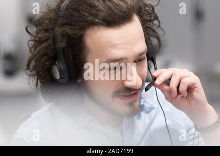male call centre operator doing his job Stock Photo