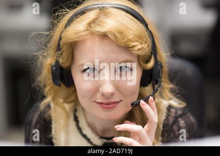female call centre operator doing her job Stock Photo