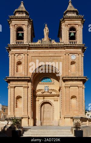 1890 Parish Church of Our Lady of Pompei, Marsaxlokk. Roman Catholic Archdiocese of Malta. Front entrance with twin bell towers. Stock Photo