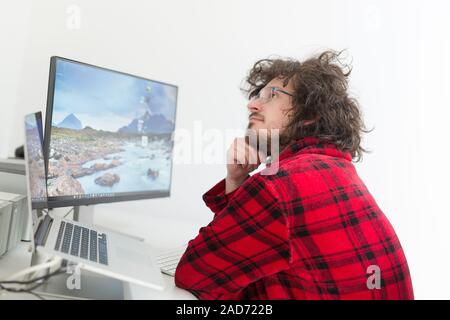 graphic designer in bathrobe working at home Stock Photo