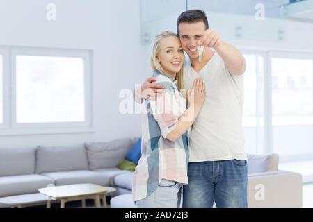 couple showing a keys of their new house Stock Photo - Alamy