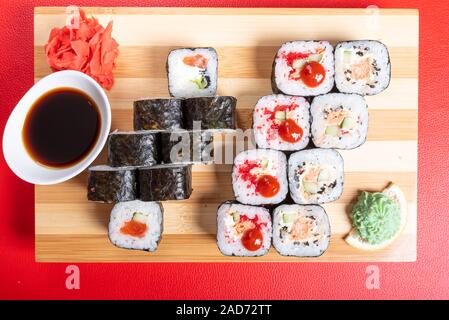 Set of rolls with various fillings, shrimp, salmon and tuna. Close-up. Stock Photo