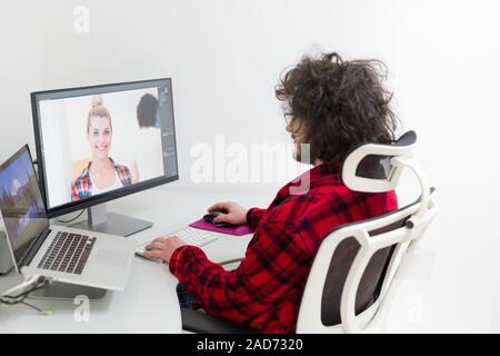 graphic designer in bathrobe working at home Stock Photo