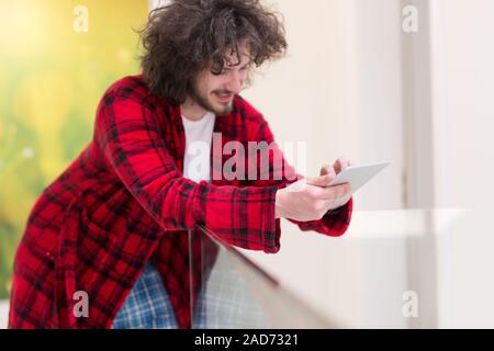 young freelancer using tablet computer Stock Photo