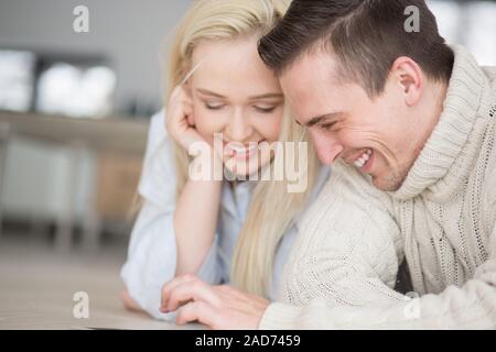 Young Couple using digital tablet on cold winter day Stock Photo