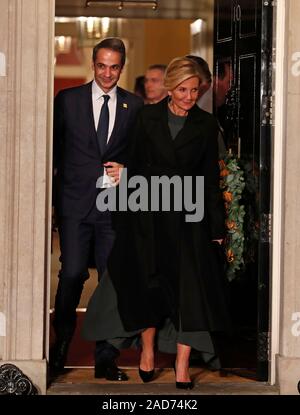 Greek Prime Minister Kyriakos Mitsotakis and his wife Mareva leave after attending an evening reception for Nato leaders hosted by Prime Minister Boris Johnson at 10 Downing Street London, as Nato leaders gather to mark 70 years of the alliance. PA Photo. Picture date: Tuesday December 3, 2019. Photo credit should read: Alastair Grant/PA Wire Stock Photo