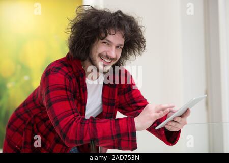 young freelancer using tablet computer Stock Photo