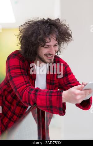 young freelancer using tablet computer Stock Photo