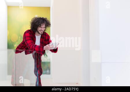 young freelancer using tablet computer Stock Photo