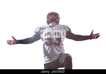 american football player celebrating after scoring a touchdown Stock Photo