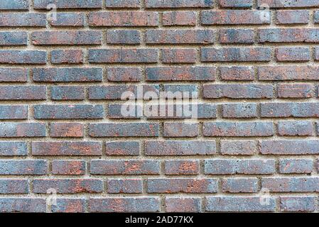 Background from a dark red brick wall Stock Photo