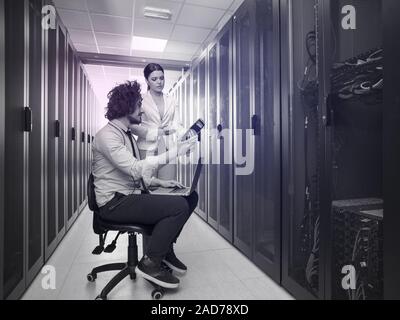 technicians working together on servers Stock Photo