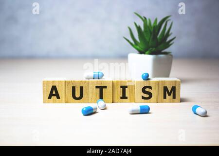 Autism - word from wooden blocks with letters, autism spectrum disorder ASD concept. medical business concept, background.. Healthcare conceptual for Stock Photo