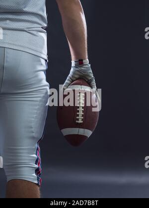 closeup American Football Player isolated on gray Stock Photo