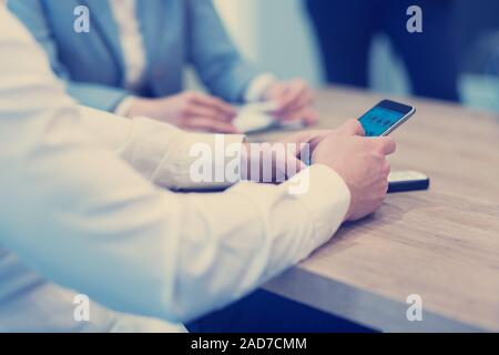 Young casual Businessman using smartphone Stock Photo