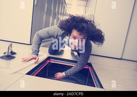 engineer connecting cables in server room Stock Photo
