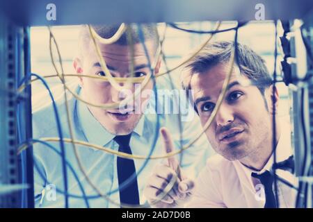 it engineers in network server room Stock Photo