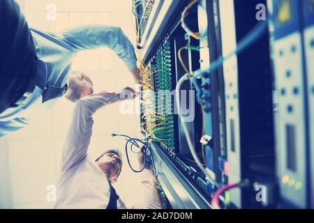 it engineers in network server room Stock Photo