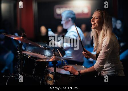 Sophie Alloway playing drums in London. Stock Photo