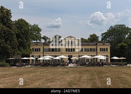 guests on the terrace in front of the restaurant in the historic park Schoenbusch, Aschaffenburg, Ge Stock Photo