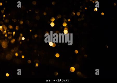 Splash of golden sparkles on black background. Stock Photo