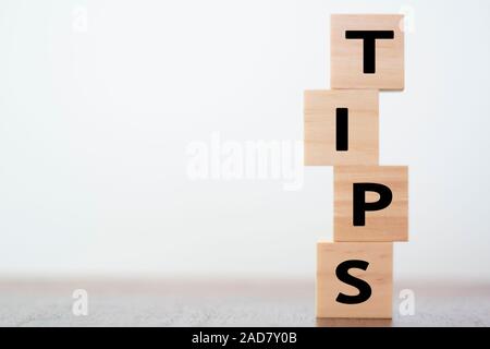 Tips written on wooden cubes with copy space Stock Photo