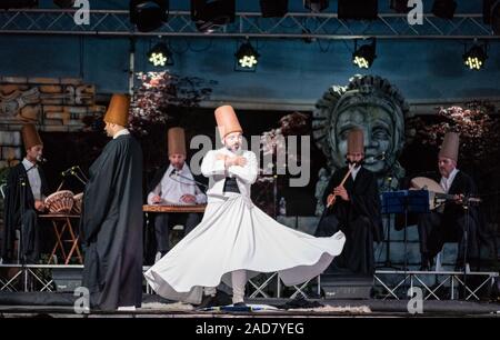 The Turkish whirling dancers or Sufi whirling dancers performing of the Mevlevi (whirling dervish) sema  at the festival LO SPIRITO DEL PIANETA Stock Photo
