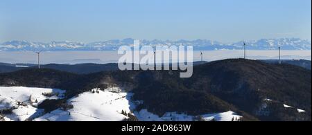 Rohrenkopf wind farm near Gersbach in the southern Black Forest. View to the Swiss Alps. Stock Photo