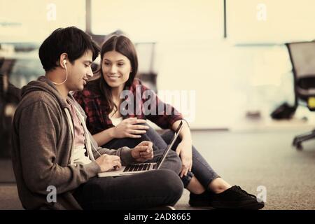 software developers couple working on the floor Stock Photo