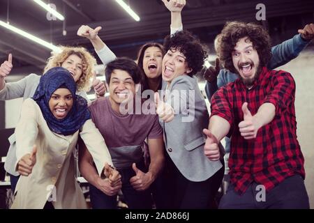 portrait of young excited multiethnics Business team Stock Photo