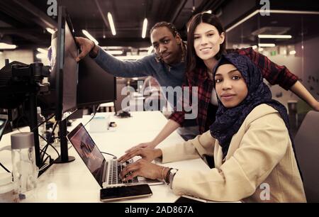 multiethnics team of software developers working together Stock Photo