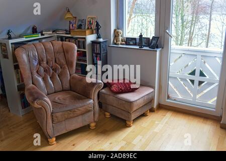 Old leather armchair Stock Photo