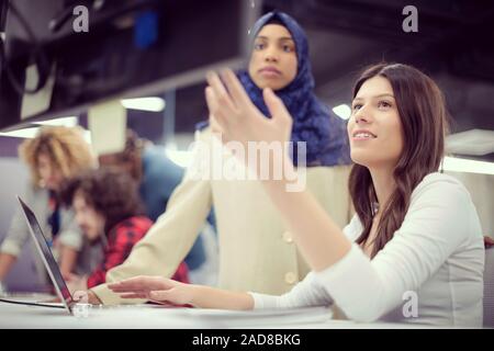 multiethnics team of software developers working together Stock Photo
