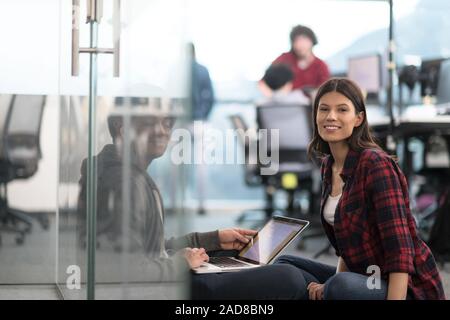 software developers couple working on the floor Stock Photo
