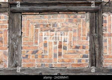 Bricks at a half-timbered house as background Stock Photo