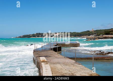 Beautiful azure sea and the rocky beach, Tyrrhenian sea in Tuscany, Italy Stock Photo