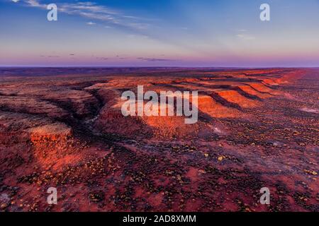 Sunset in the remote Australian outback. An aerial image of the George Gill Range near Kings Creek, Northern Territory, Australia. Stock Photo