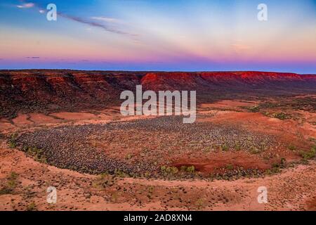 Sunset in the remote Australian outback. An aerial image of the George Gill Range near Kings Creek, Northern Territory, Australia. Stock Photo