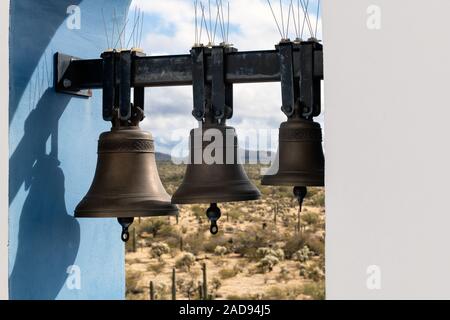 Bell tower of Elijah Chapel at Saint Anthony Greek Orthodox Monastery in Florence, Arizona.  Focus on the  the bells. Stock Photo