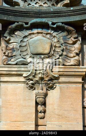 Architectural details on building, stone carving, aesthetic frills. Stock Photo
