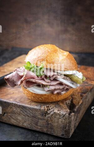 Traditional sliced cold cuts roast beef sandwich with onion Stock Photo
