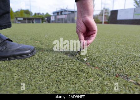 Damaged artificial turf Stock Photo