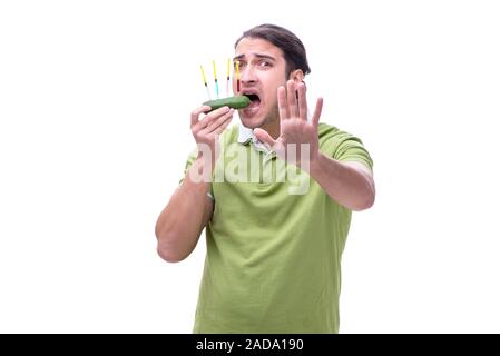 Young man in GMO fruits and vegetables concept Stock Photo