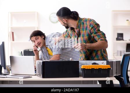 IT engineers working on hardware issue Stock Photo